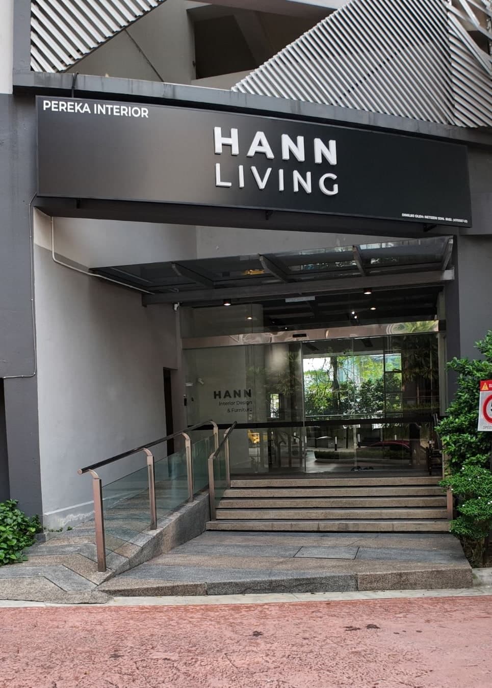 Hann Living showroom entrance in Bangsar with the HANN LIVING sign above the steps